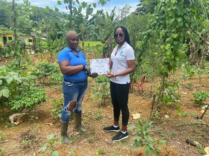 Christina Palmer receiving the farming grant